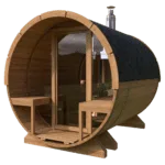 A wooden barrel-shaped outdoor sauna with a glass front door, two small benches at the entrance, and a black tiled roof section on one end, this inviting barrel sauna is a perfect garden sauna retreat.